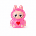 Squishy personnage rose pailleté kawaii anti-stress, ultra mignon, doux et moelleux.