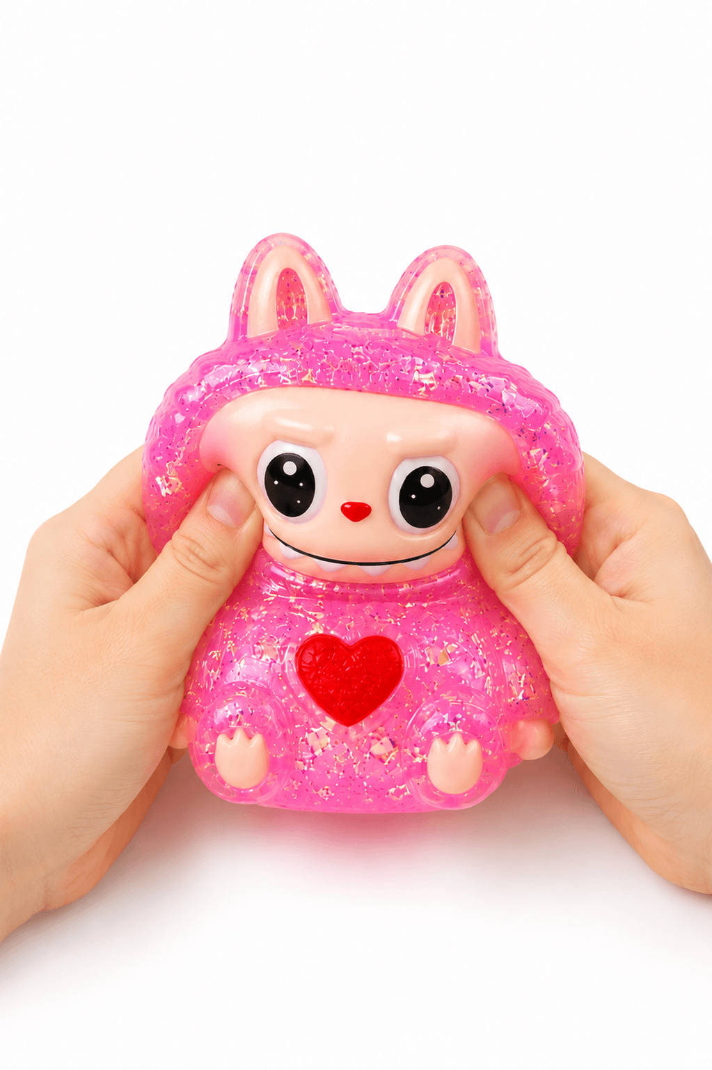 Squishy personnage rose pailleté kawaii ultra moelleux, idéal pour la détente et le plaisir tactile.