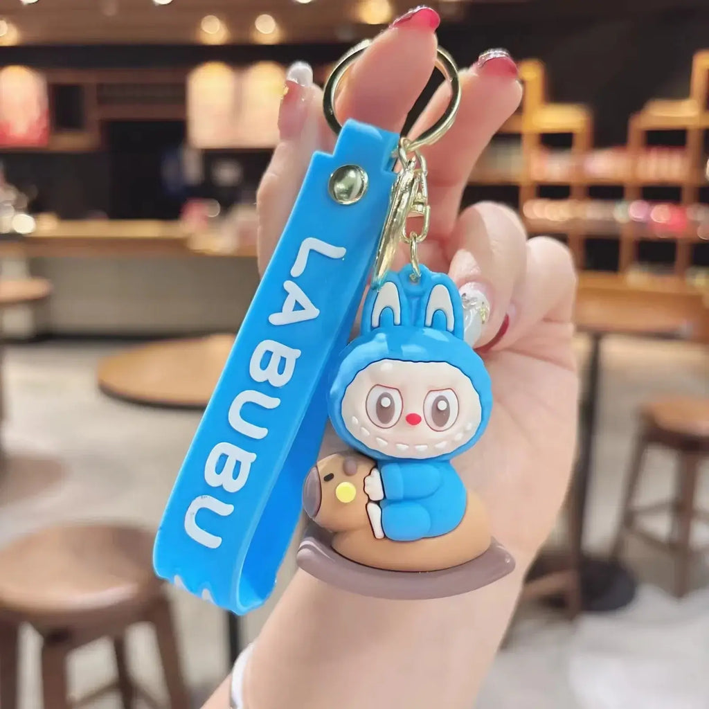 Porte-clés Labubu bleu kawaii au design mignon et coloré, accessoire tendance pour clés et sacs.